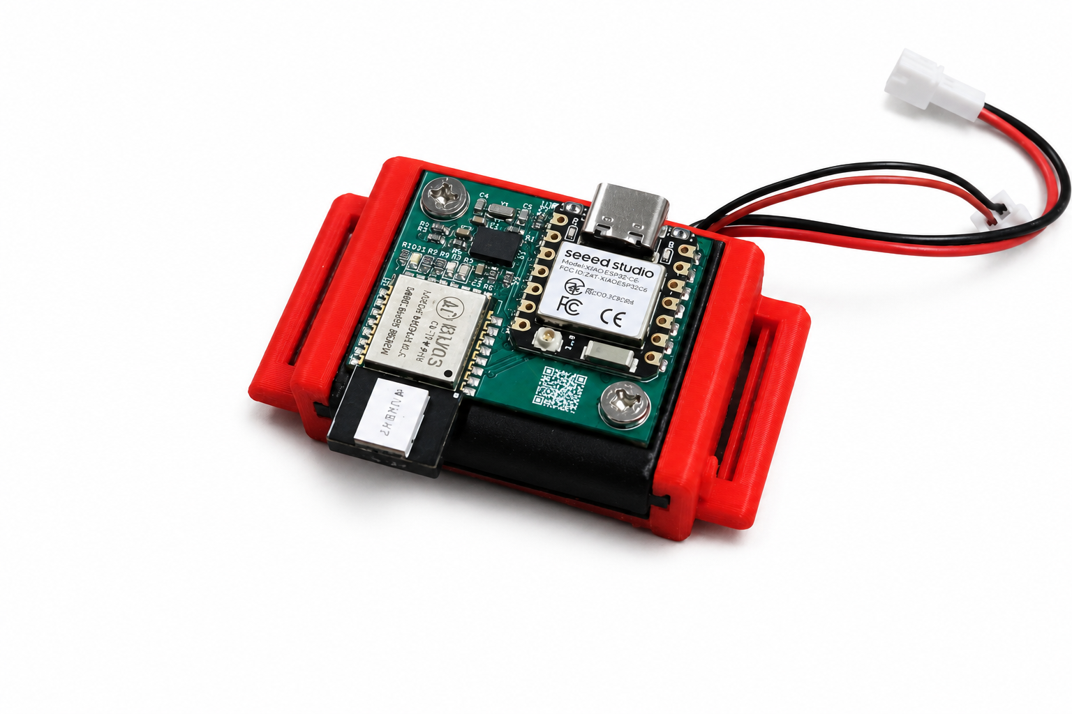 WaviTrack sensor node with an exposed circuit board and battery in a red-and-black enclosure